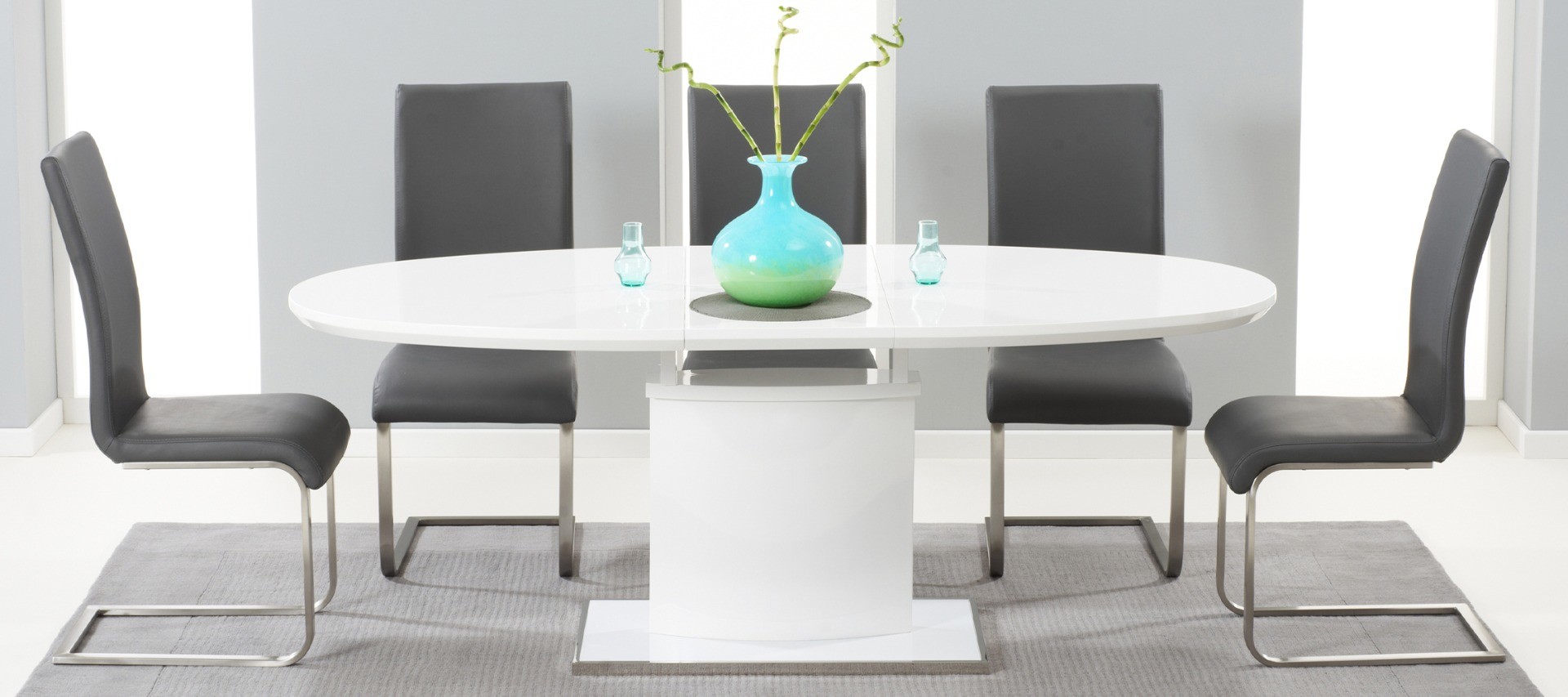 Photo 1 of Extending valzo 160cm white high gloss pedestal dining table with 6 grey austin chairs