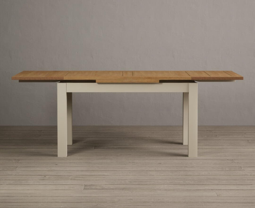Product photograph of Extending Buxton 140cm Oak And Cream Painted Dining Table from Oak Furniture Superstore