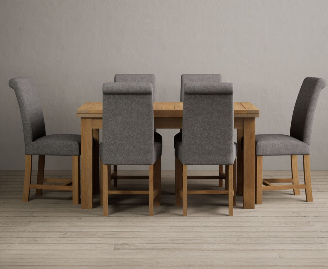 Photo 1 of Extending hampshire 140cm solid oak dining table with 8 charcoal grey braced leg chairs