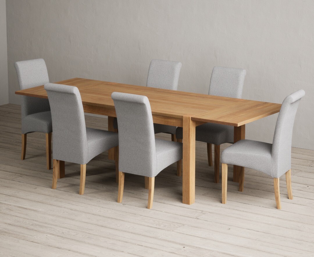 Product photograph of Thetford 150cm Oak Dining Table With Thetford 45cm Oak Extensions With 8 Grey Scroll Back Chairs from Oak Furniture Superstore