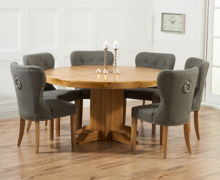 Product photograph of Helmsley 150cm Solid Oak Round Pedestal Dining Table With 6 Grey Keswick Fabric Chairs from Oak Furniture Superstore