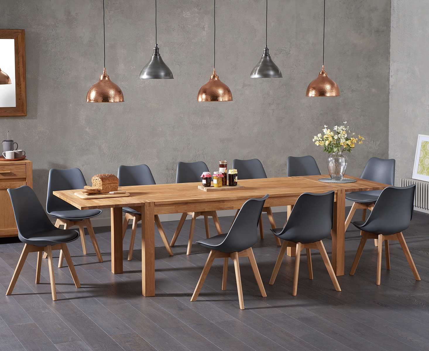 Product photograph of Extending Thetford 180cm Solid Oak Dining Table With 8 Dark Grey Orson Faux Leather Chairs from Oak Furniture Superstore