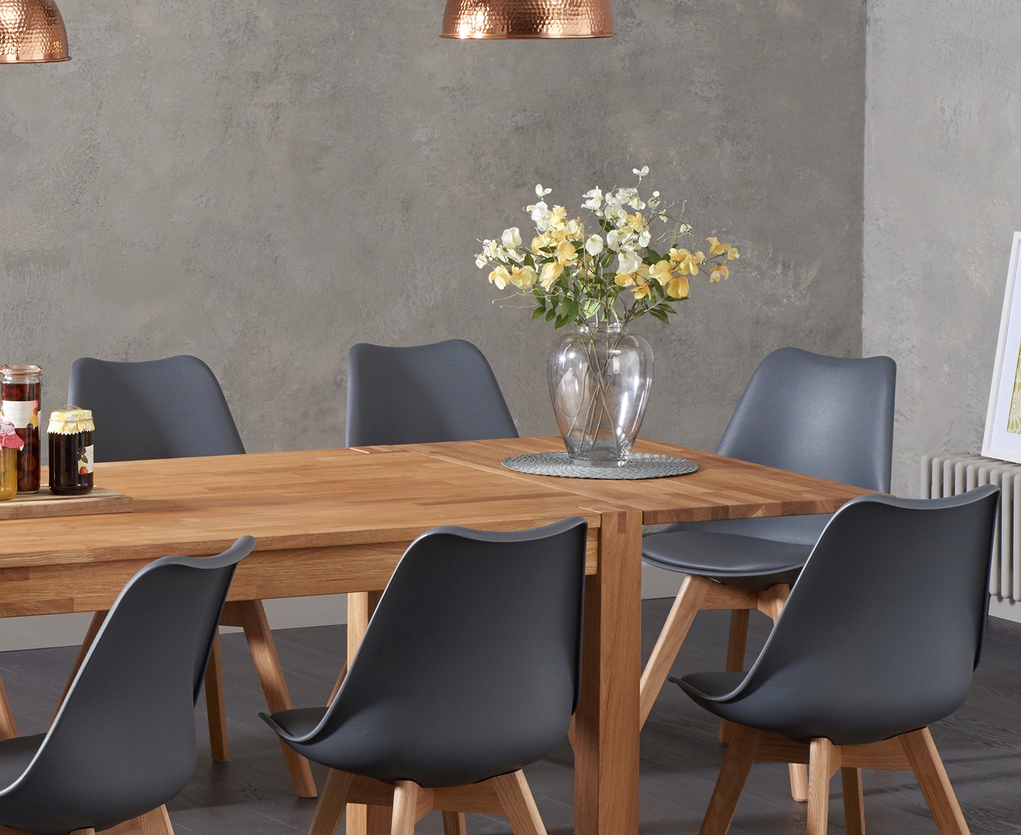 Photo 1 of Extending thetford 180cm solid oak dining table with 8 dark grey orson faux leather chairs