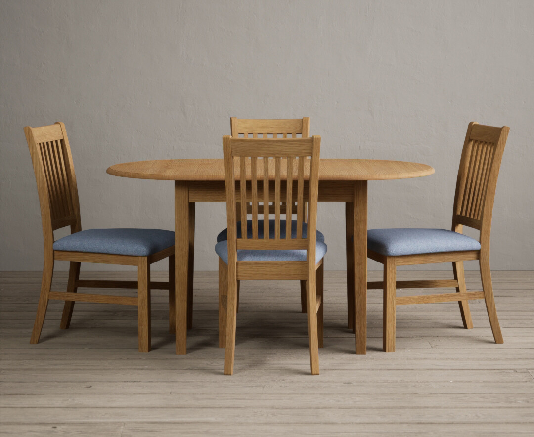 Photo 1 of Extending warwick solid oak dining table with 4 blue warwick chairs