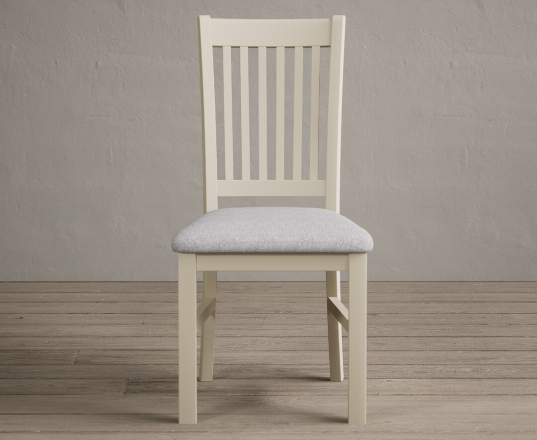 Product photograph of Warwick Cream Dining Chairs With Light Grey Fabric Seat Pad from Oak Furniture Superstore