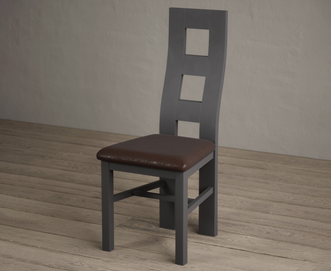 Photo 2 of Painted charcoal grey flow back dining chairs with brown suede seat pad