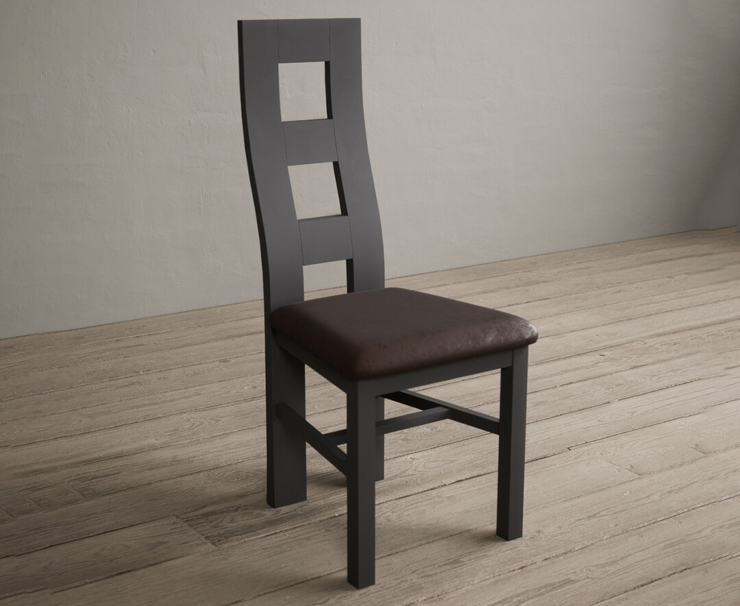 Photo 1 of Painted charcoal grey flow back dining chairs with brown suede seat pad
