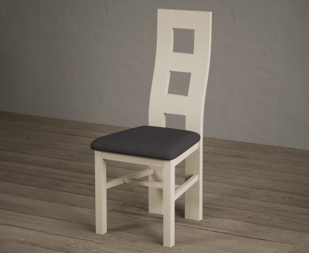 Photo 1 of Painted cream flow back dining chairs with charcoal grey fabric seat pad