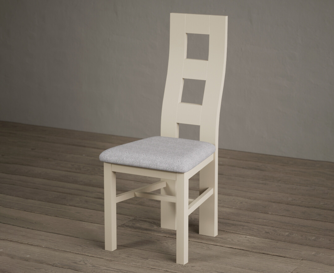 Photo 1 of Painted cream flow back dining chairs with light grey fabric seat pad