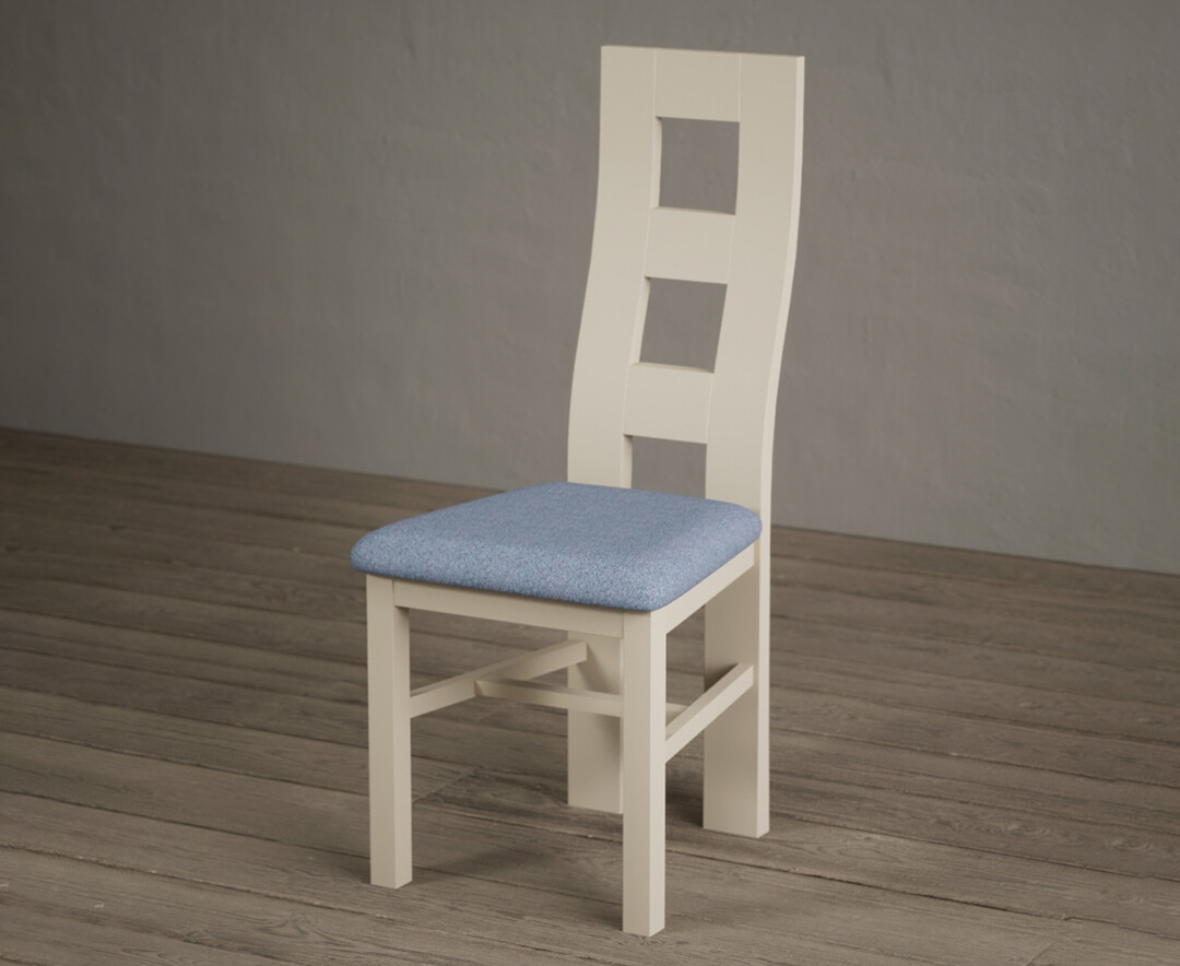 Photo 1 of Painted cream flow back dining chairs with blue fabric seat pad