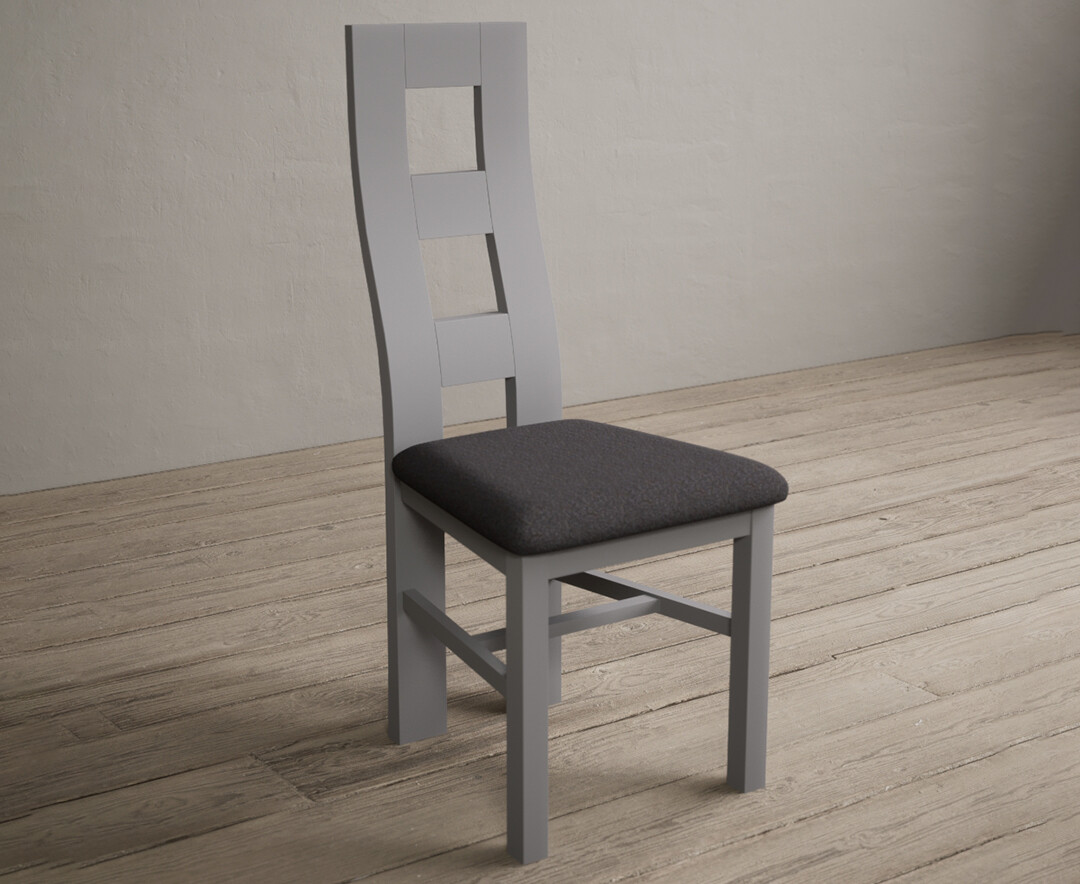 Photo 1 of Painted light grey flow back dining chairs with charcoal grey fabric seat pad