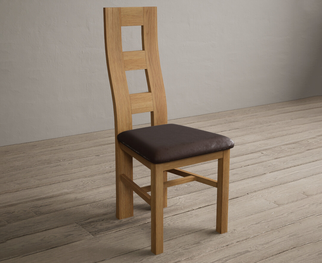 Photo 1 of Natural solid oak flow back dining chairs with brown suede seat pad