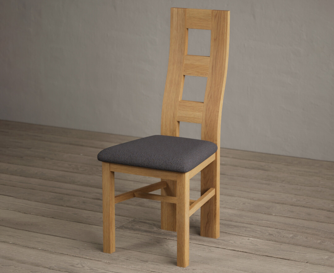 Photo 2 of Natural solid oak flow back dining chairs with charcoal grey fabric seat pad