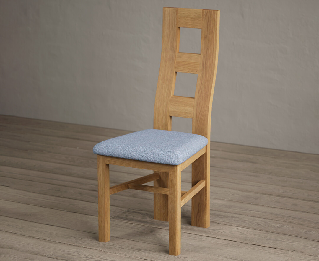 Photo 2 of Natural solid oak flow back dining chairs with blue fabric seat pad