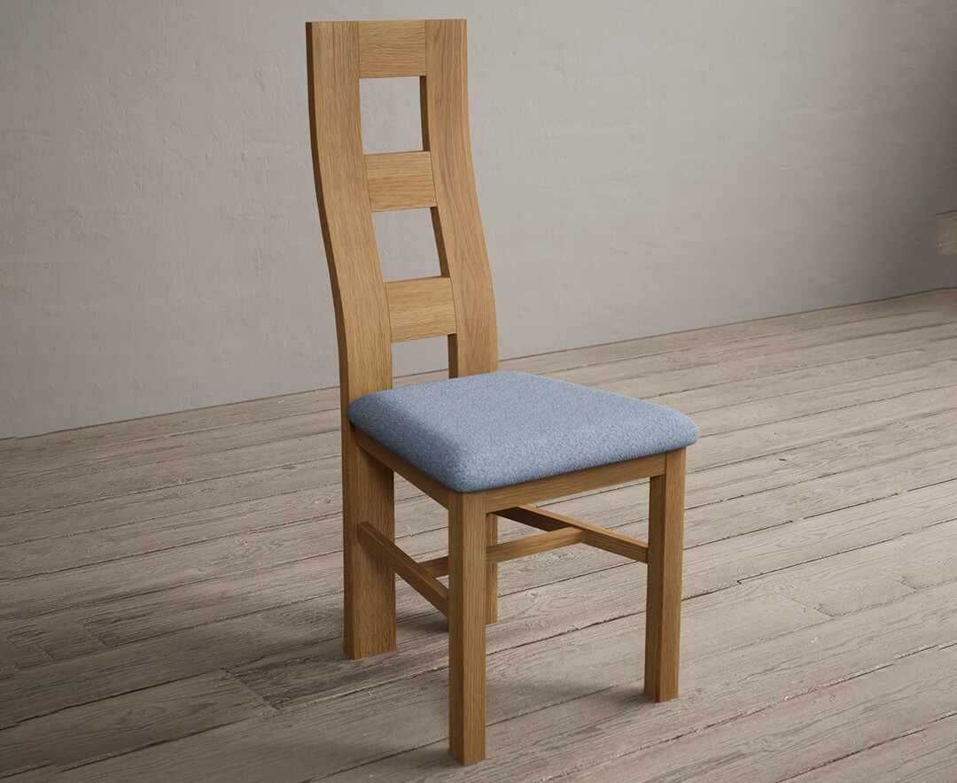 Photo 1 of Natural solid oak flow back dining chairs with blue fabric seat pad
