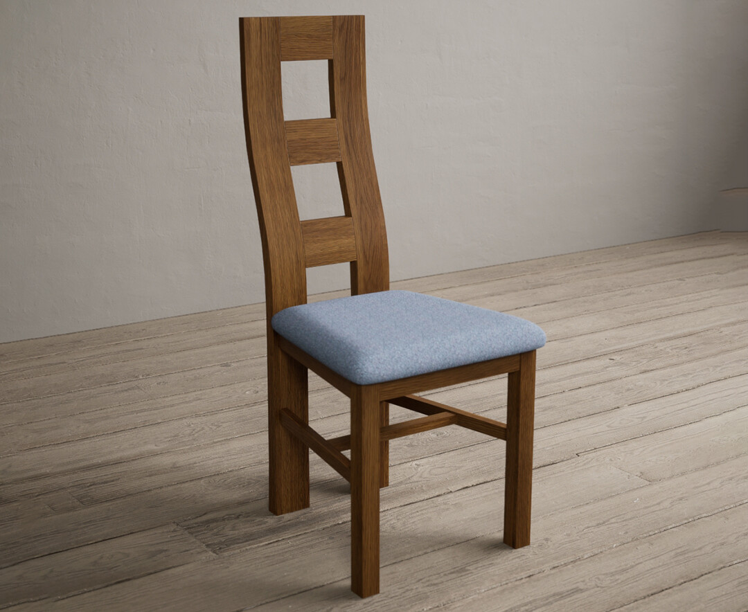 Photo 1 of Rustic solid oak flow back dining chairs with blue fabric seat pad