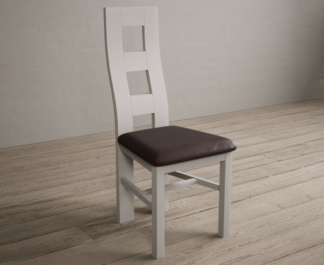Photo 1 of Painted soft white flow back dining chairs with brown suede seat pad