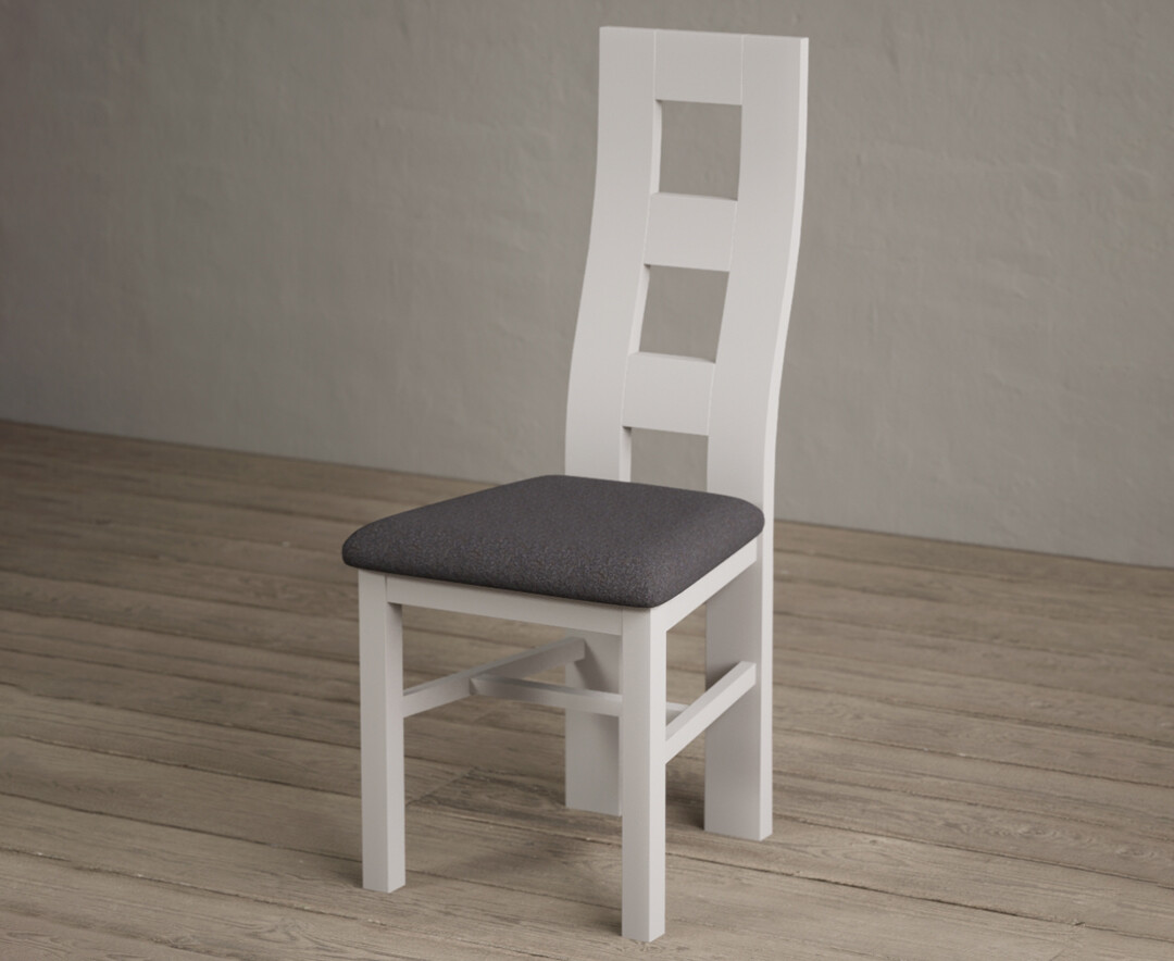 Photo 2 of Painted soft white flow back dining chairs with charcoal grey fabric seat pad