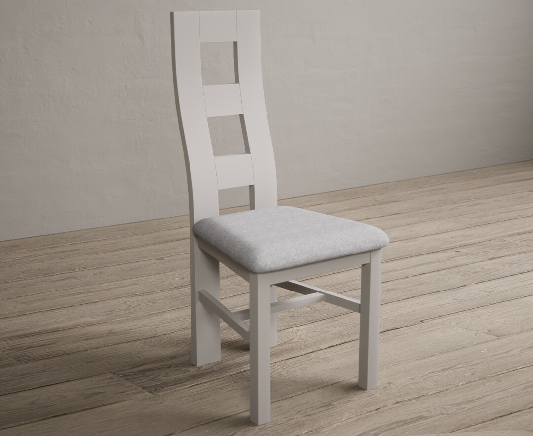 Photo 1 of Painted soft white flow back dining chairs with light grey fabric seat pad