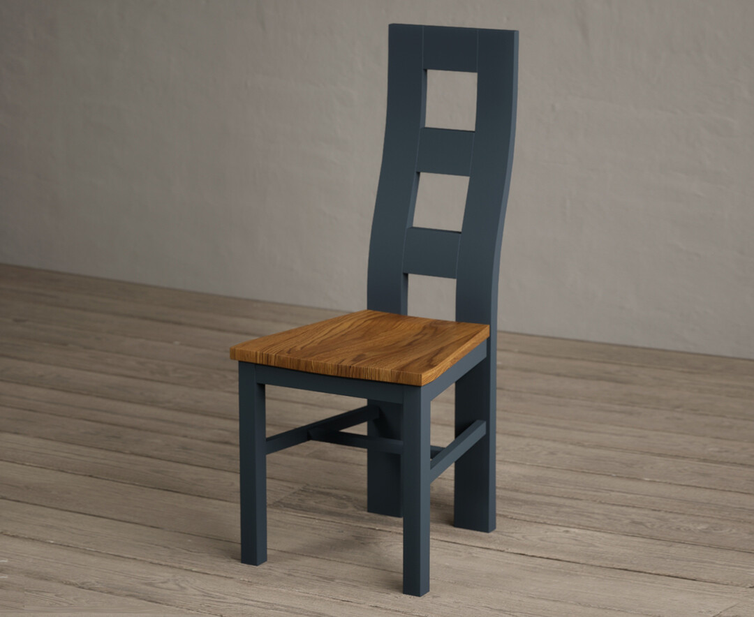 Photo 1 of Painted dark blue flow back dining chairs with rustic oak seat pad