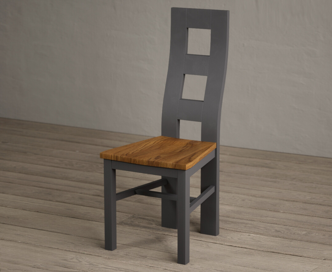 Photo 1 of Painted charcoal grey flow back dining chairs with rustic oak seat pad