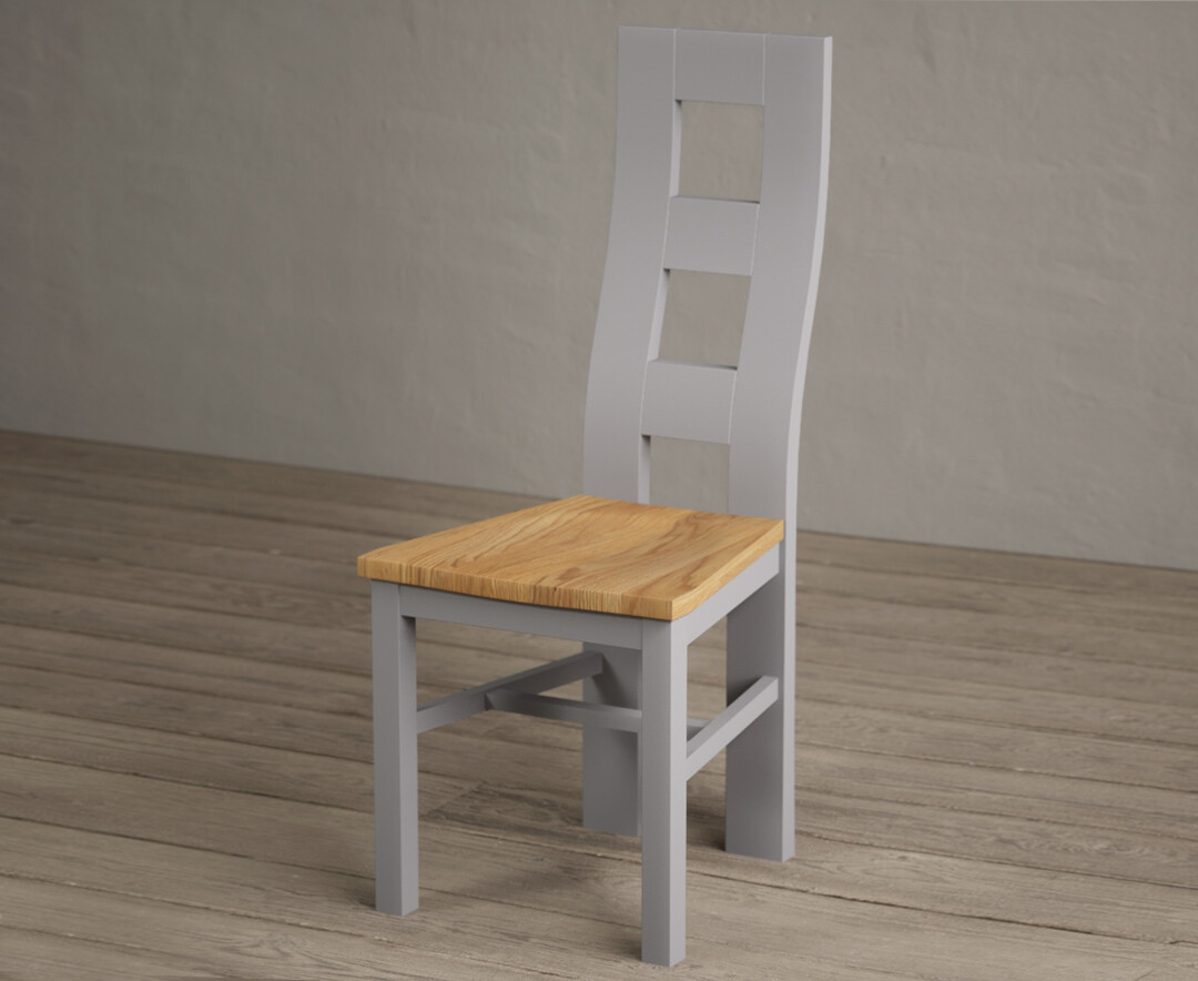 Photo 1 of Painted light grey flow back dining chairs with oak seat pad