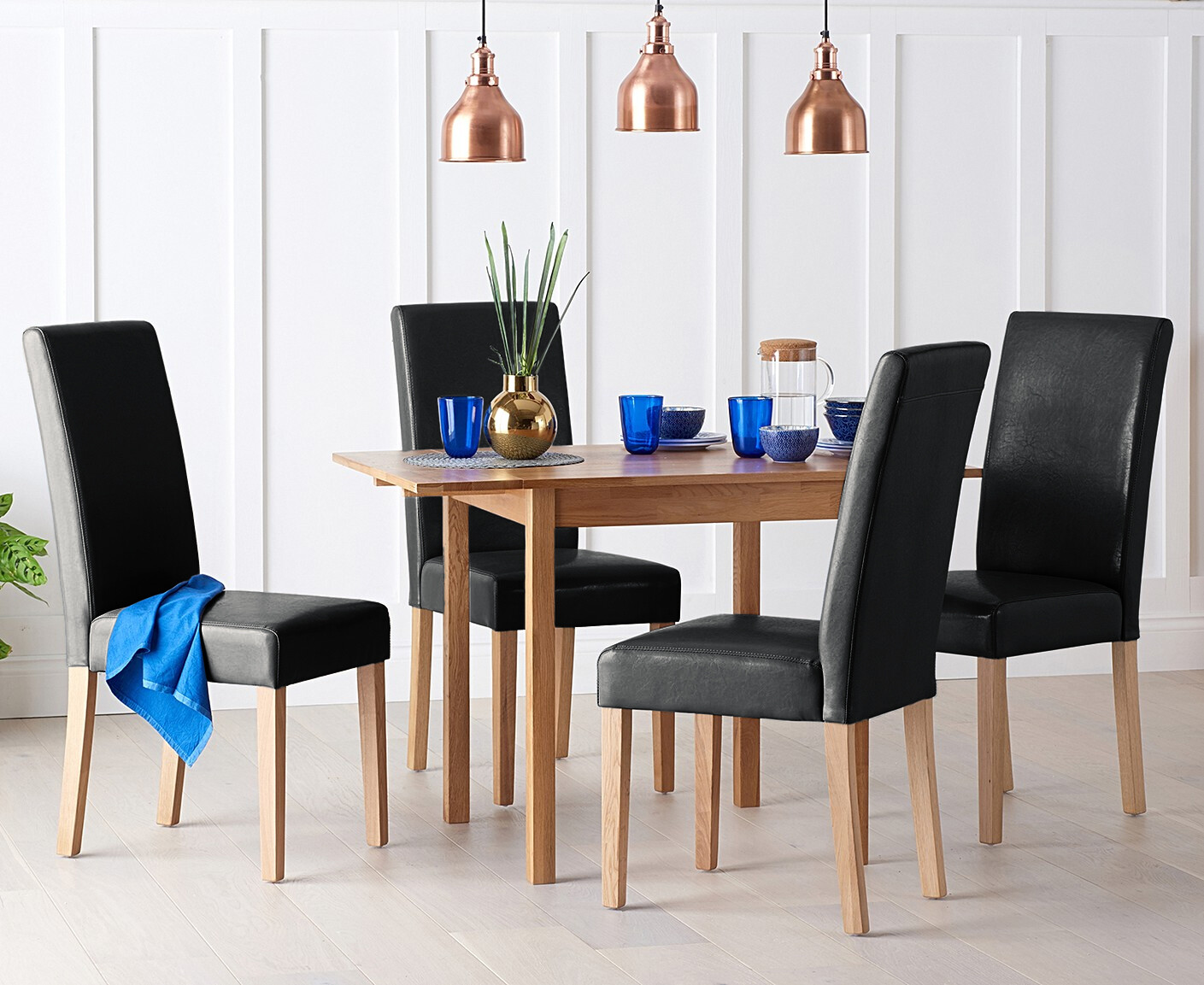 Product photograph of Extending York 70cm Solid Oak Dining Table With 2 Black Olivia Chairs from Oak Furniture Superstore