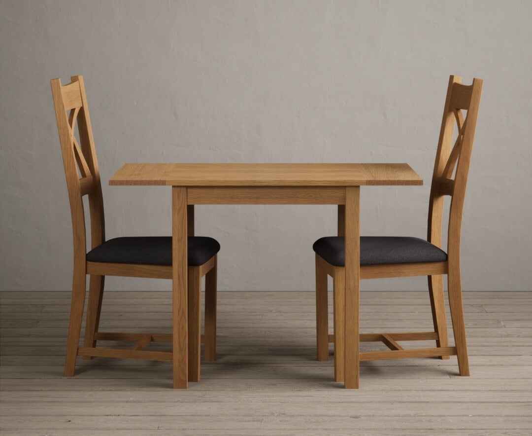 Product photograph of Extending York 70cm Solid Oak Dining Table With 2 Charcoal Grey X Back Chairs from Oak Furniture Superstore