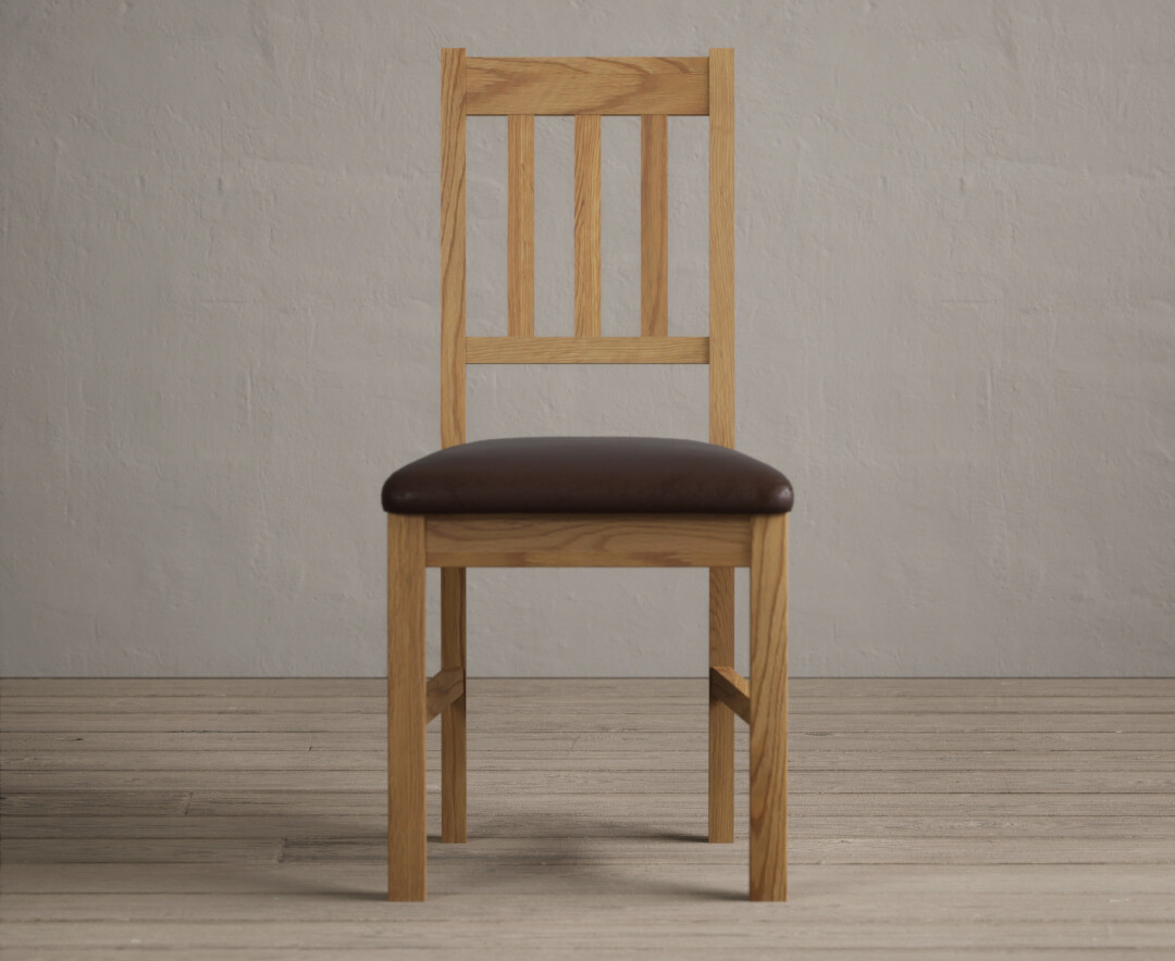 Product photograph of York Solid Oak Dining Chairs With Brown Suede Seat Pad from Oak Furniture Superstore