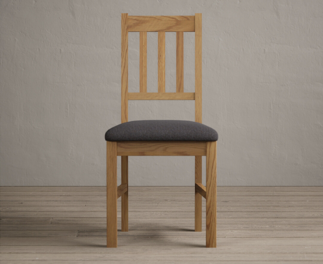 Product photograph of York Solid Oak Dining Chairs With Charcoal Grey Fabric Seat Pad from Oak Furniture Superstore
