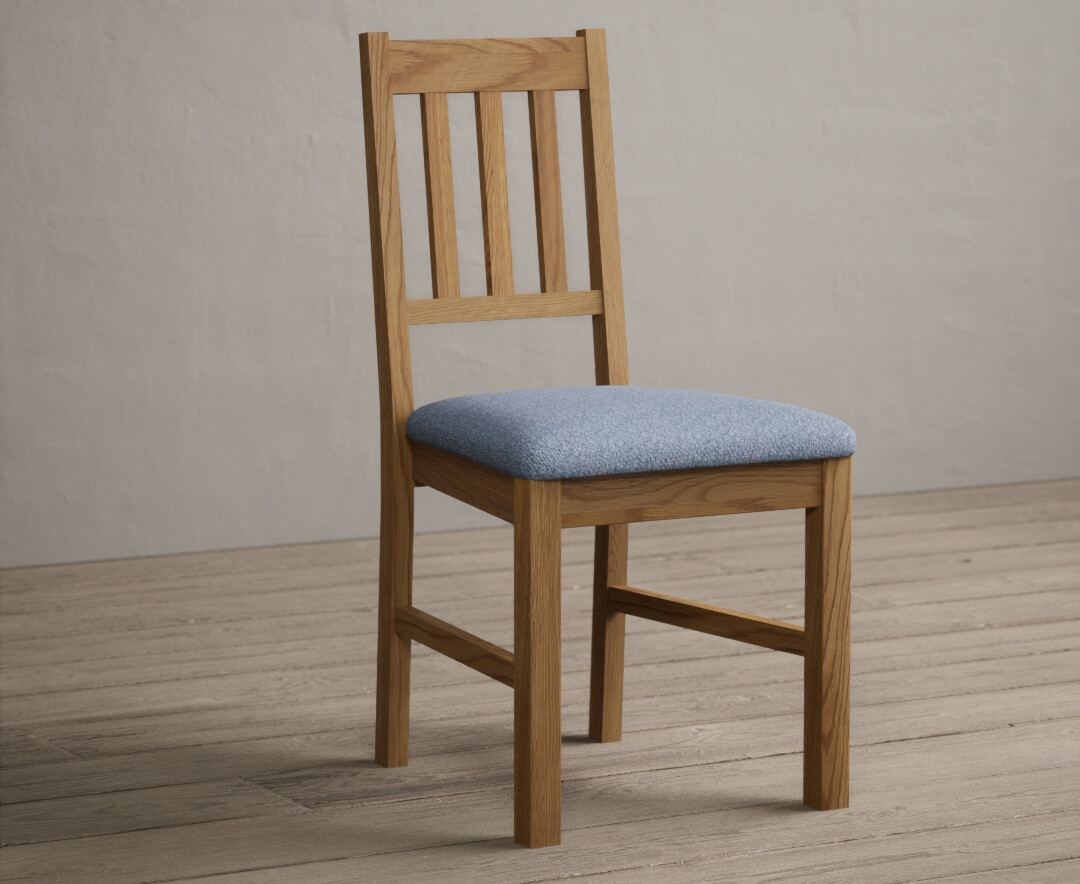 Photo 1 of York solid oak dining chairs with blue fabric seat pad