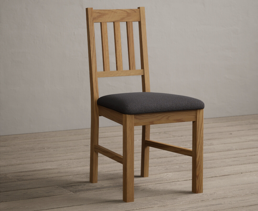Product photograph of York Solid Oak Dining Chairs With Charcoal Grey Fabric Seat Pad from Oak Furniture Superstore.